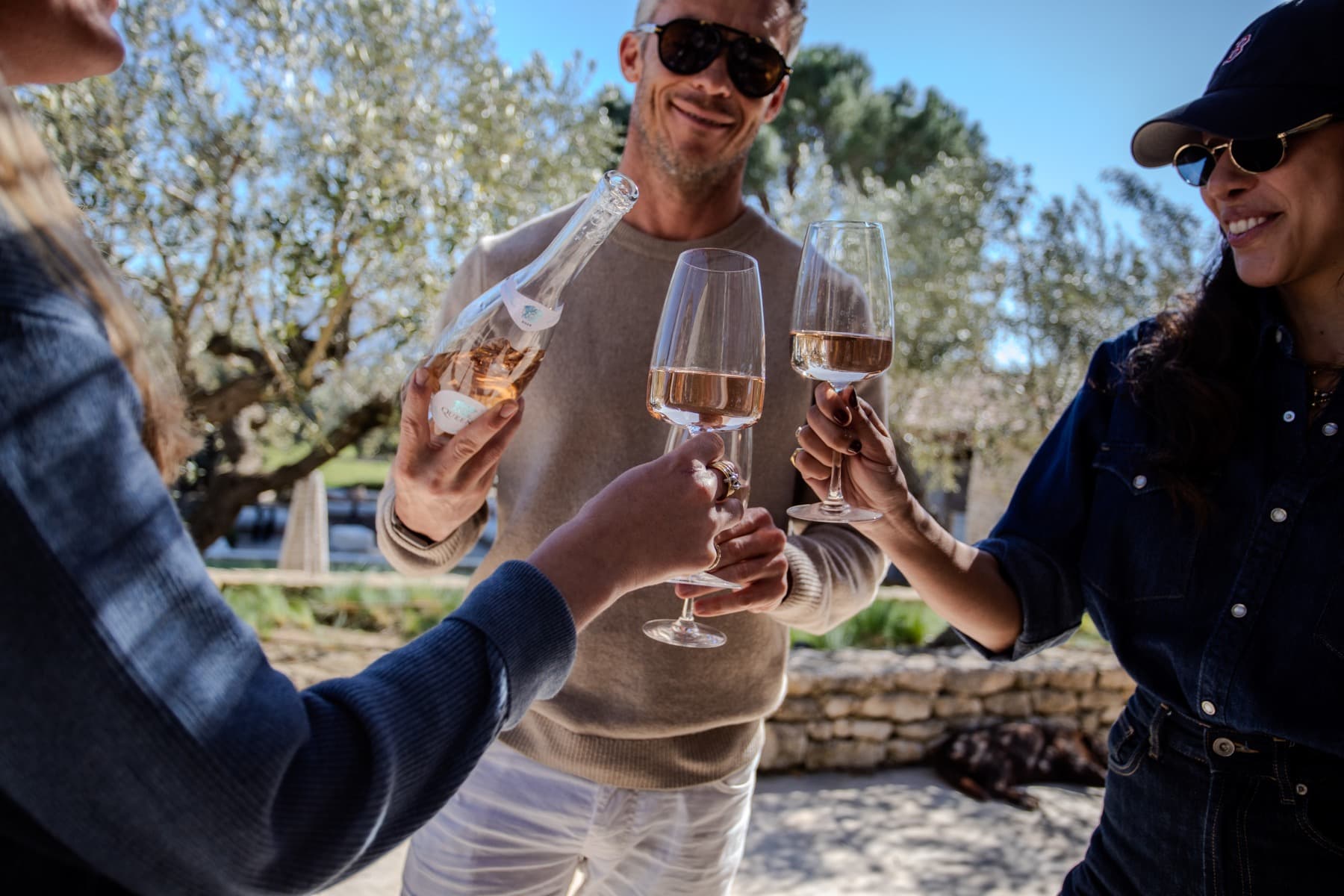 Three friends enjoying Queen Côtes De Provence Rosé outdoors